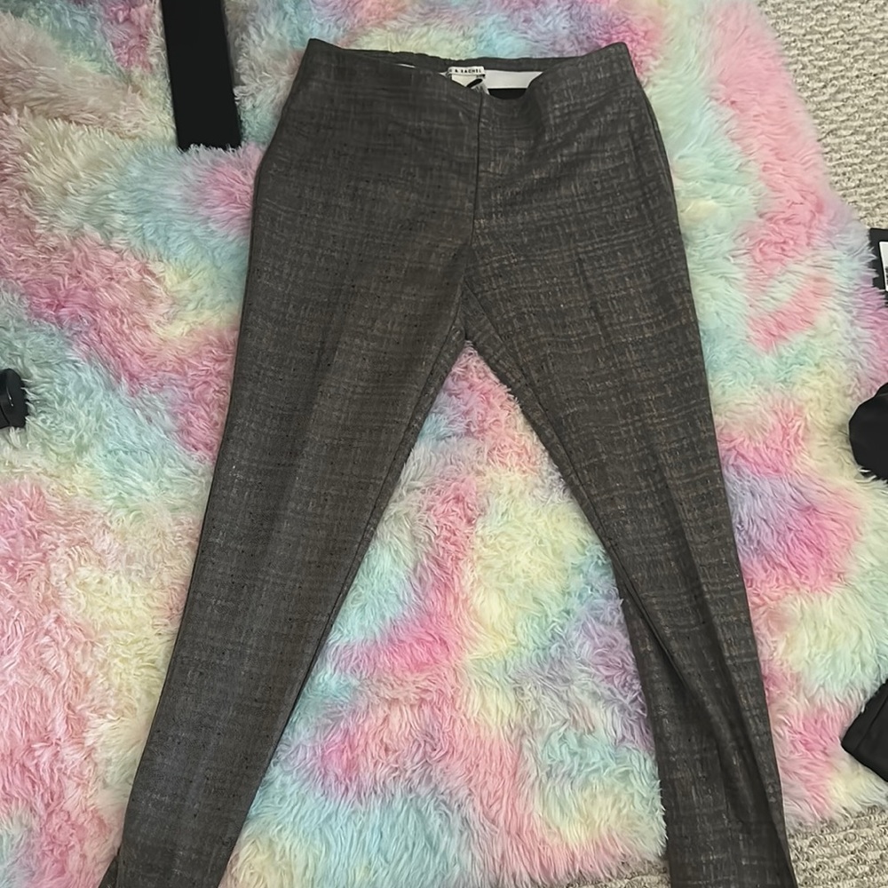Medium size legging pants ; in grey; hints of black and gold, ankle trim.